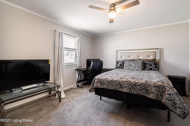 carpeted bedroom featuring baseboards, ornamental molding, and a ceiling fan