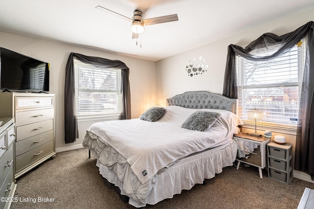 carpeted bedroom featuring a ceiling fan and baseboards