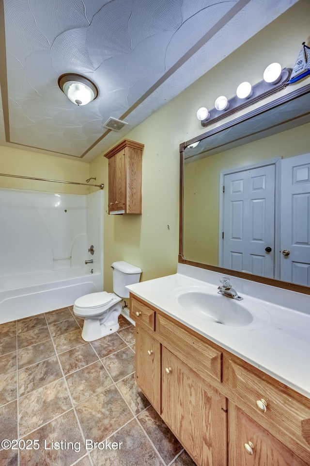 full bathroom featuring toilet, vanity, and shower / bathing tub combination