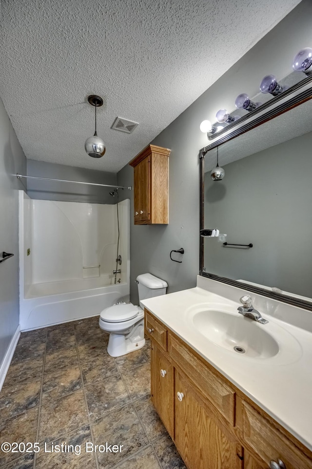 bathroom featuring visible vents, toilet, tub / shower combination, a textured ceiling, and vanity