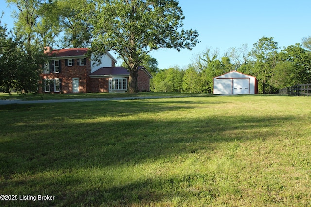 1472 Mulberry Pike, Eminence, KY 40019 - view of yard featuring a storage unit, a garage, and an outbuilding