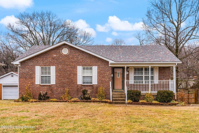 view of front of home featuring an outbuilding, a garage, a front lawn, and covered porch