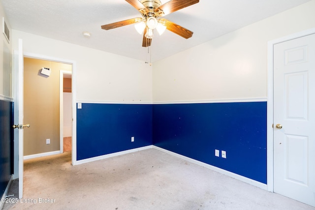 unfurnished room featuring carpet floors and ceiling fan