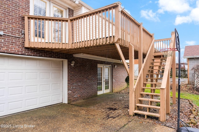 exterior space with a garage and a deck