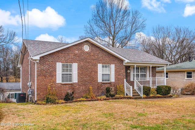 view of front of house featuring a front yard, central AC unit, and covered porch