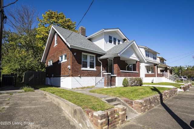 view of front of home with a front lawn