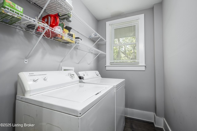 clothes washing area with washing machine and clothes dryer