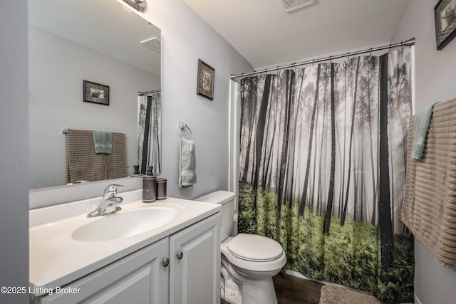 bathroom with hardwood / wood-style flooring, vanity, toilet, and a shower with curtain