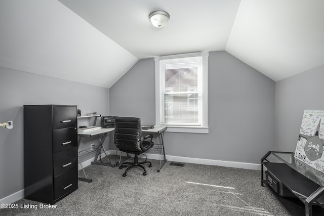 office area featuring carpet floors and vaulted ceiling