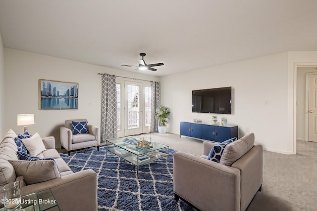 carpeted living room featuring ceiling fan