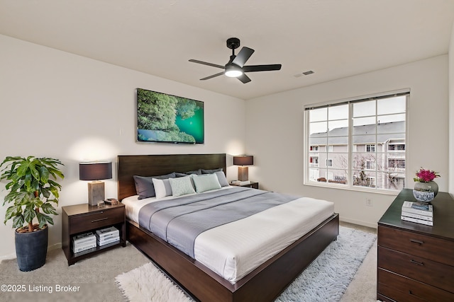 carpeted bedroom with ceiling fan