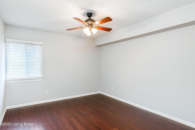 empty room with wood-type flooring and ceiling fan