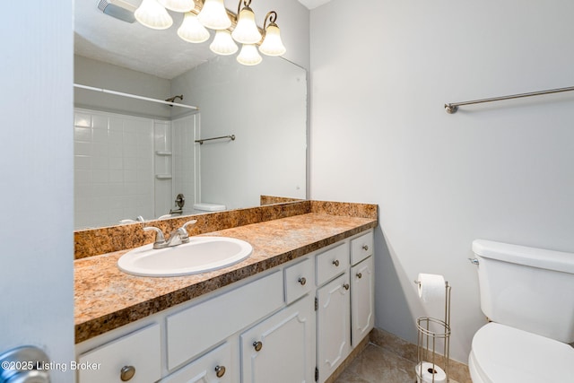 bathroom with vanity, a shower, tile patterned floors, toilet, and a chandelier