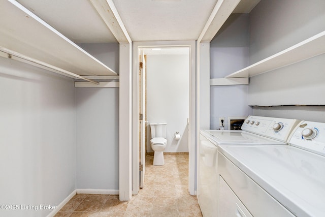 laundry area featuring washing machine and dryer