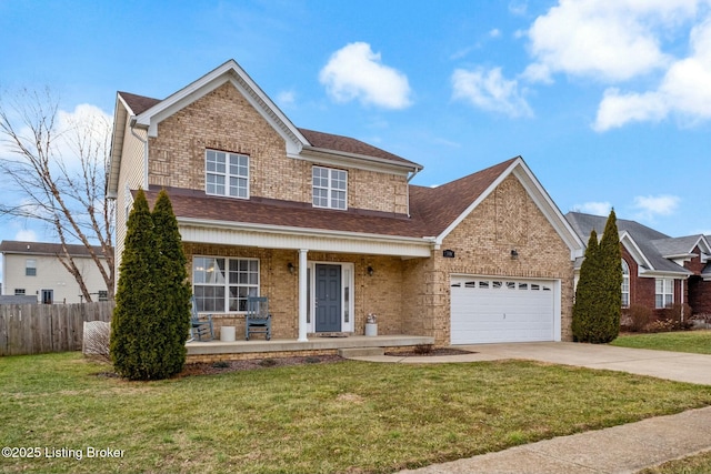 view of front of house with a front lawn, a garage, and a porch