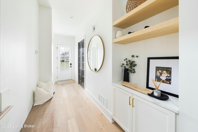 hallway featuring light wood-type flooring