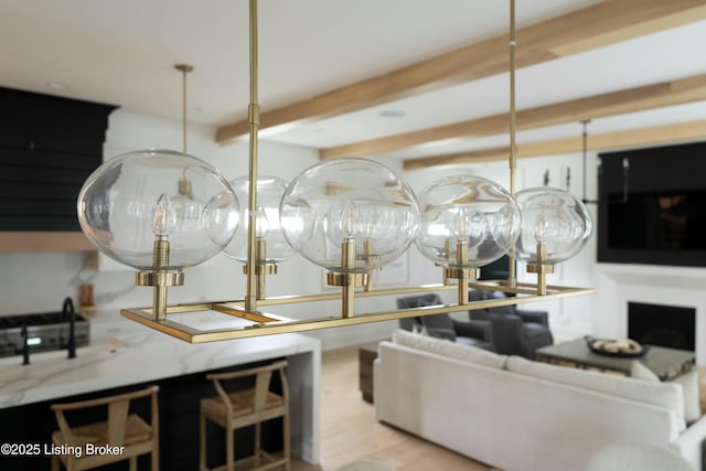 interior space with beamed ceiling and light hardwood / wood-style floors