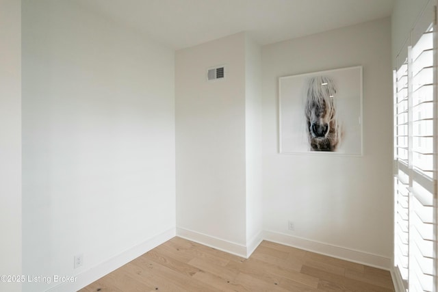 spare room featuring light hardwood / wood-style flooring