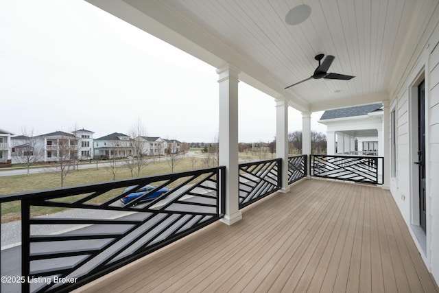 wooden terrace featuring ceiling fan