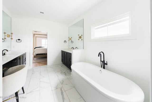 bathroom featuring vanity and a bathtub