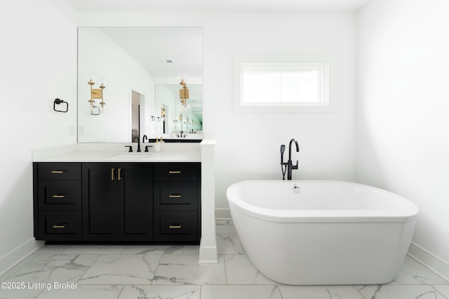 bathroom with a tub to relax in and vanity