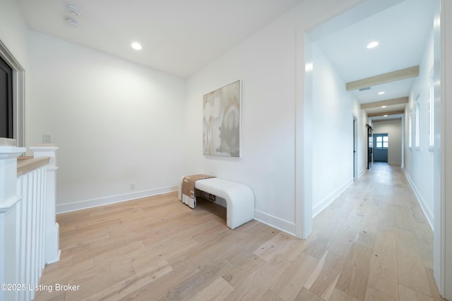 hallway with light hardwood / wood-style floors