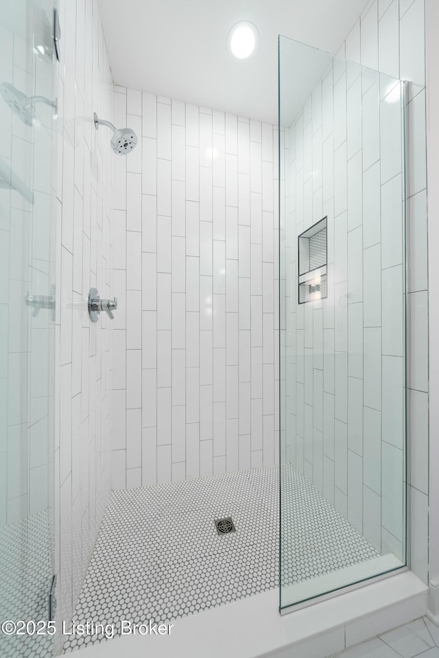 bathroom with a shower with shower door