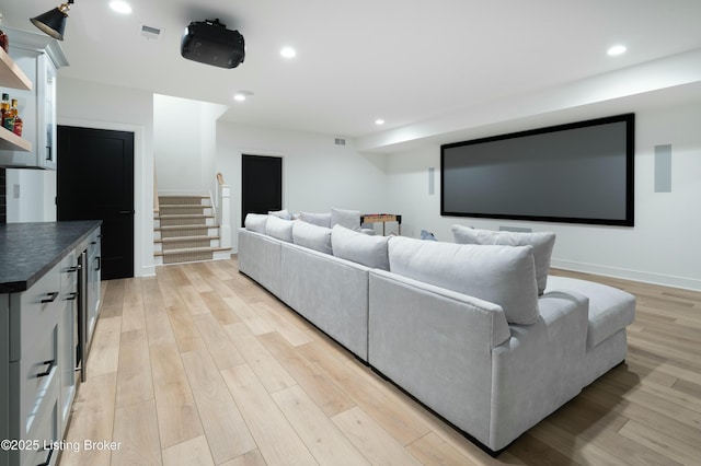 cinema featuring light hardwood / wood-style flooring