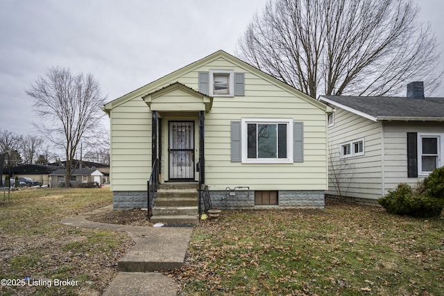 bungalow-style house with a front lawn