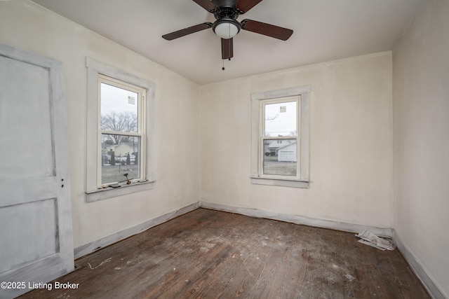 114 E Norwood Ave, Clarksville, IN 47129 - spare room with dark hardwood / wood-style flooring, plenty of natural light, and ceiling fan