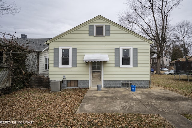 114 E Norwood Ave, Clarksville, IN 47129 - back of property featuring cooling unit, a trampoline, and a patio