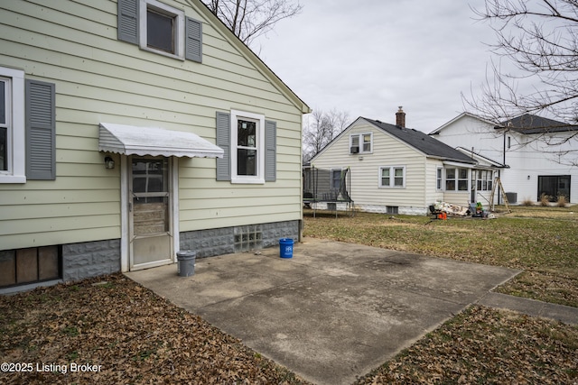 114 E Norwood Ave, Clarksville, IN 47129 - rear view of property with a patio