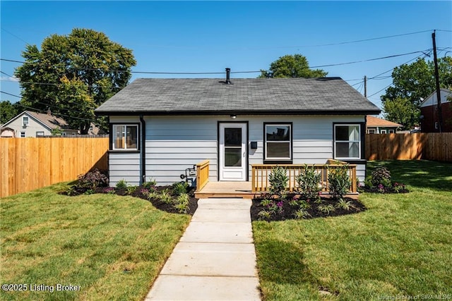 bungalow-style house with a front yard