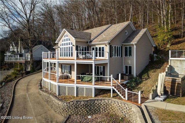 back of property with a balcony