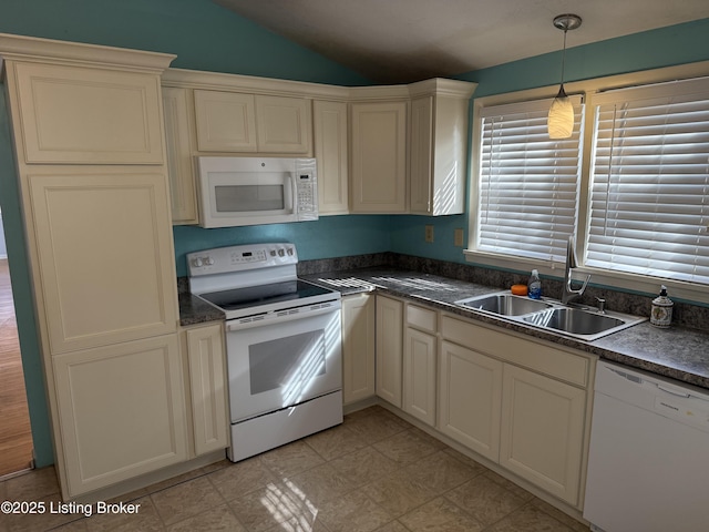 kitchen featuring lofted ceiling, sink, pendant lighting, and white appliances