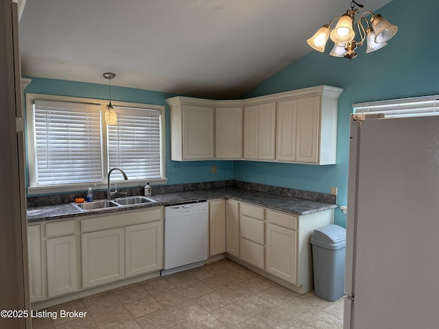 kitchen featuring sink, decorative light fixtures, vaulted ceiling, a notable chandelier, and white appliances