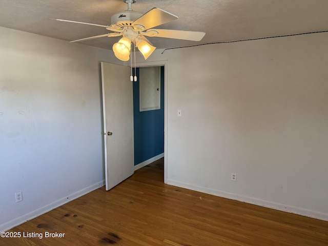 unfurnished room featuring hardwood / wood-style floors and ceiling fan