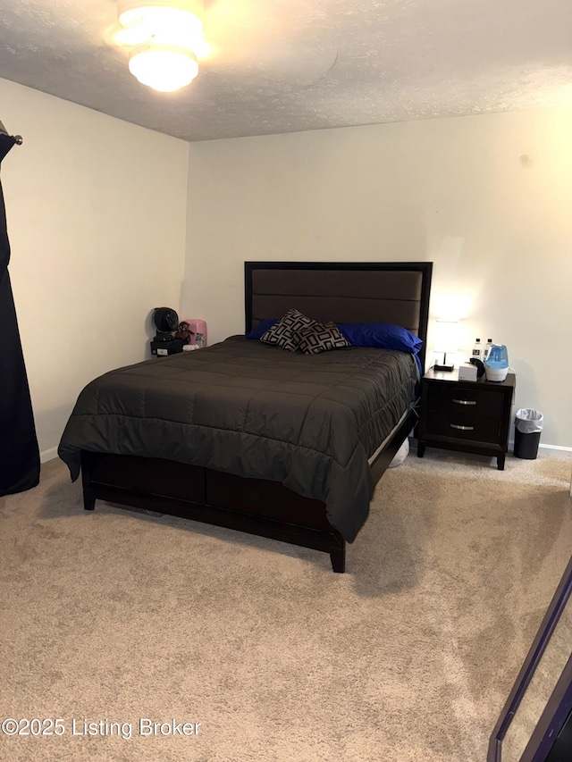 carpeted bedroom with a textured ceiling