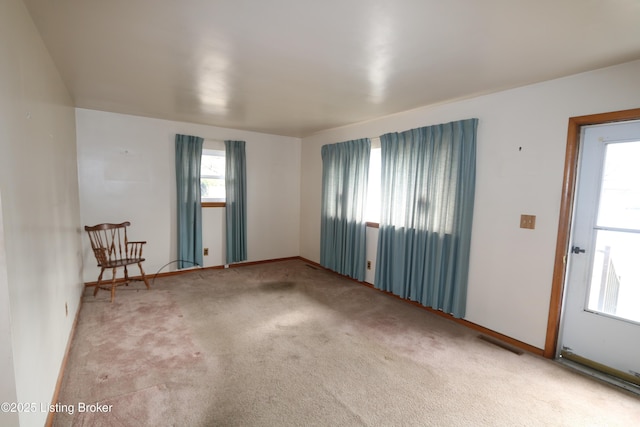 spare room featuring carpet flooring