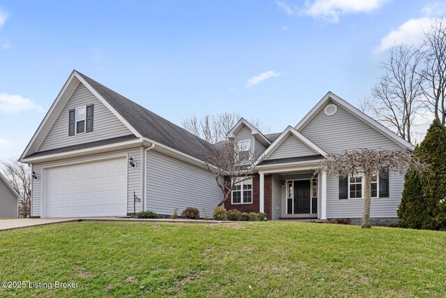 view of property with a garage and a front yard