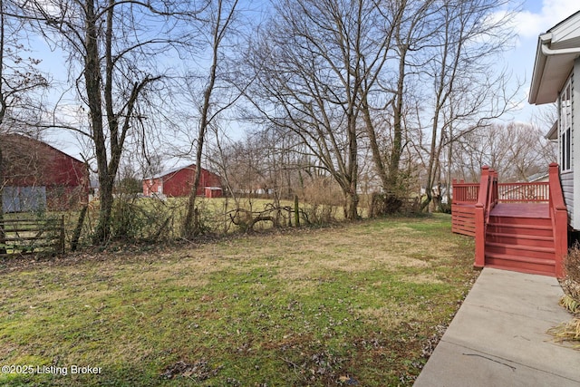 view of yard with a wooden deck