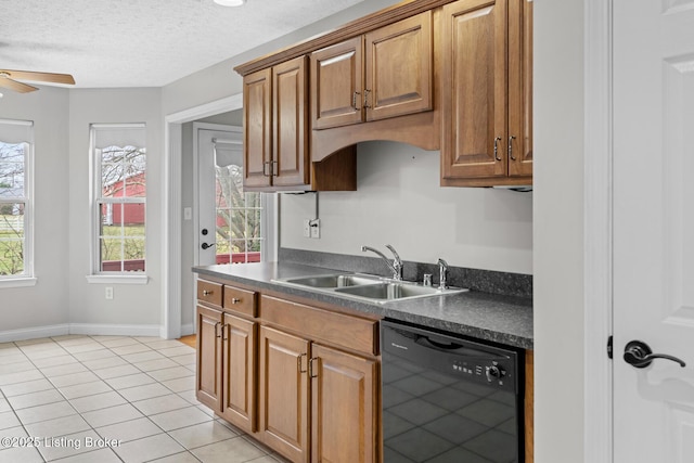 kitchen with sink, a textured ceiling, light tile patterned floors, black dishwasher, and ceiling fan