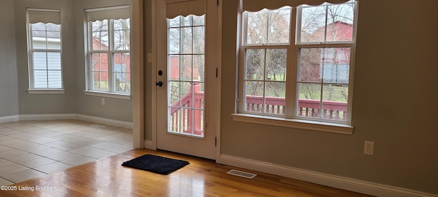 doorway featuring light tile patterned floors