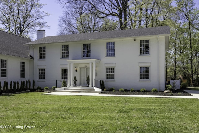 view of front of home with a front yard