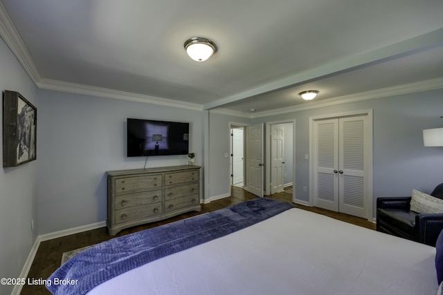 bedroom with dark wood-type flooring, ornamental molding, and a closet