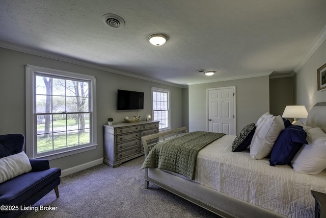 carpeted bedroom with crown molding and a textured ceiling