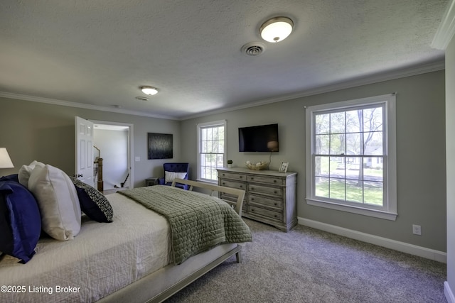 carpeted bedroom featuring ornamental molding and a textured ceiling