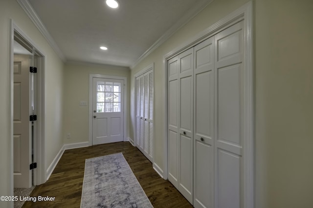 entryway with crown molding and dark hardwood / wood-style floors