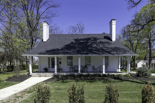 view of front of home featuring a porch and a front lawn