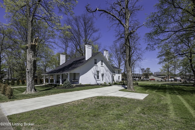 view of home's exterior with a yard